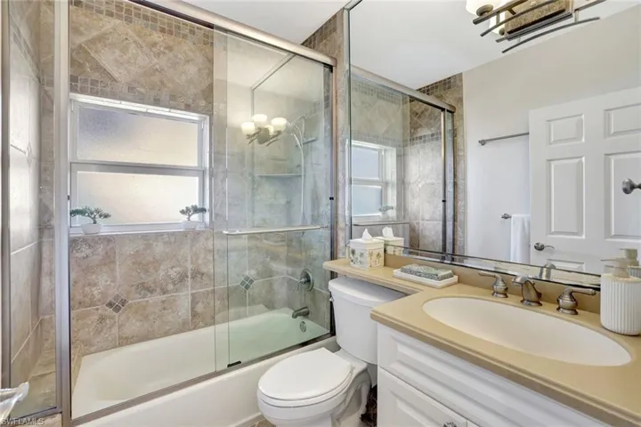 Guest bathroom with tub and shower