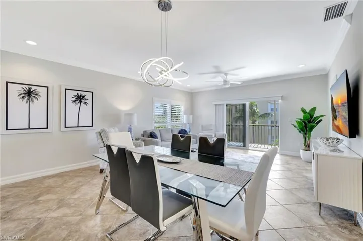 Dining area in open living area with views put to balcony