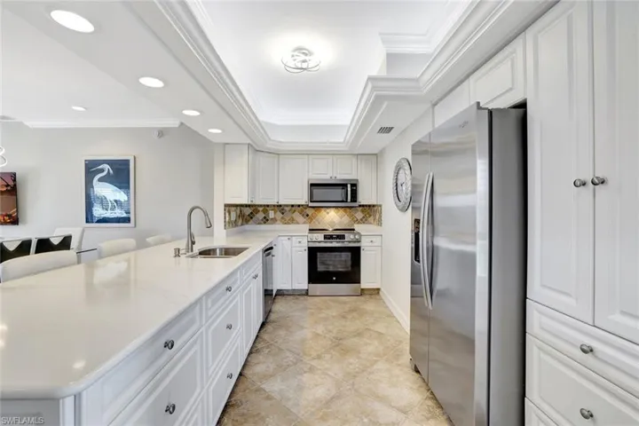 Kitchen with quartz countertops and stainless steel appliances