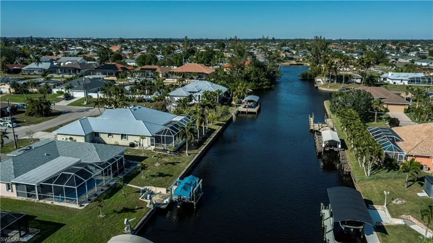 Aerial perspective of suburban area with a large body of water