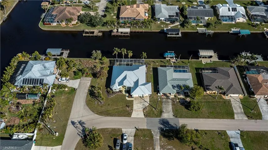 Aerial overview of property's location featuring nearby suburban area