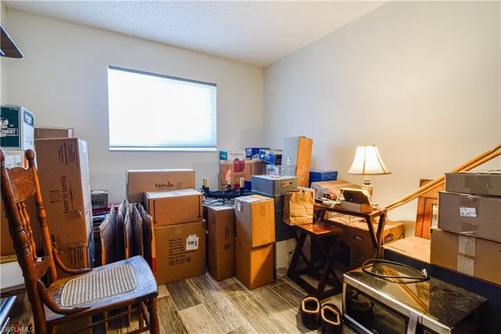 Office with hardwood / wood-style floors
