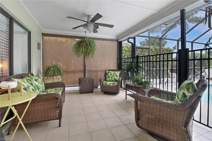 Sunroom featuring baseboard heating and ceiling fan