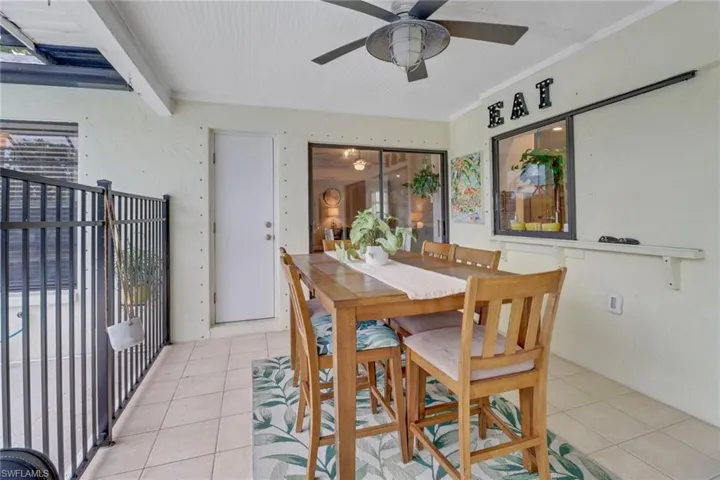 Dining space featuring ceiling fan and light tile patterned floors