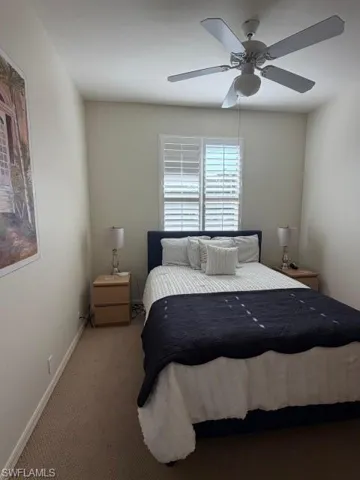 Bedroom featuring carpet flooring and ceiling fan