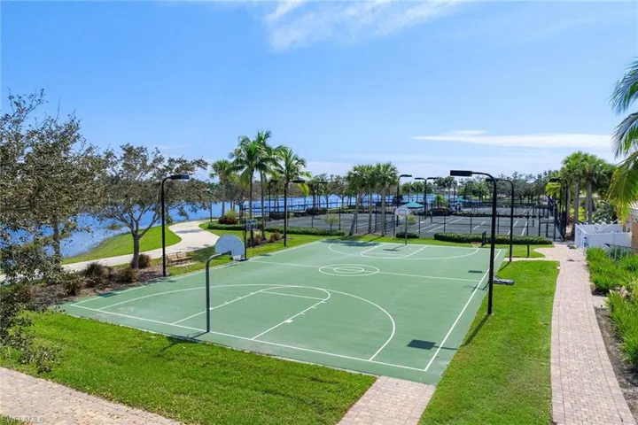 View of basketball court featuring community basketball court and a tennis court