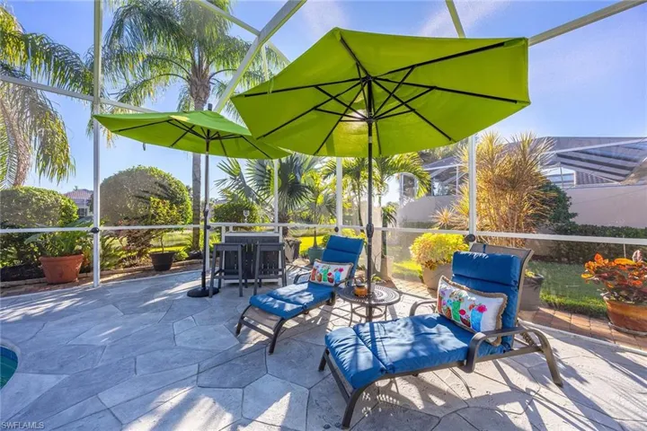 View of patio with a lanai