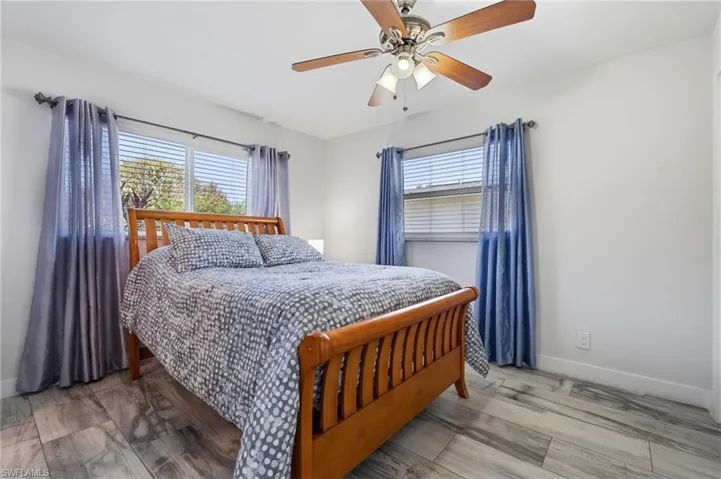 Bedroom featuring light wood-style flooring and a ceiling fan