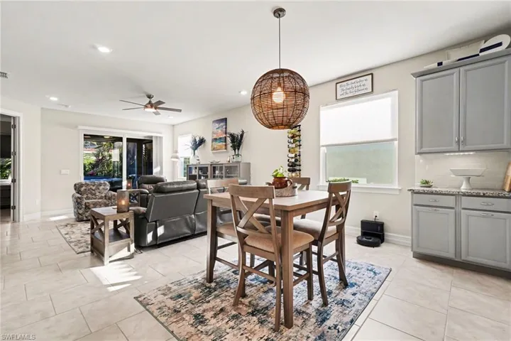 Dining space with ceiling fan and recessed lighting