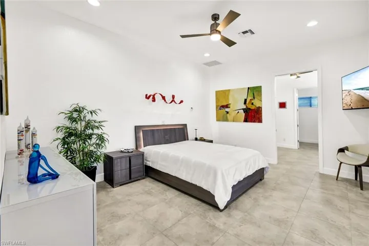 Bedroom featuring visible vents, recessed lighting, baseboards, and ceiling fan