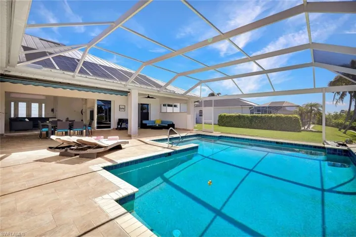 Pool featuring a patio area, an outdoor hangout area, a lanai, and a ceiling fan