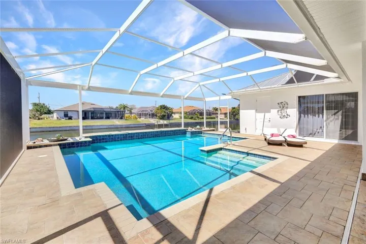 Outdoor pool featuring a patio and a lanai