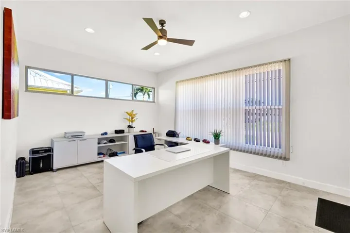 Office with a ceiling fan, light tile patterned flooring, recessed lighting, and baseboards