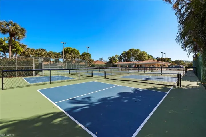 View of sport court featuring 4 pickleball courts