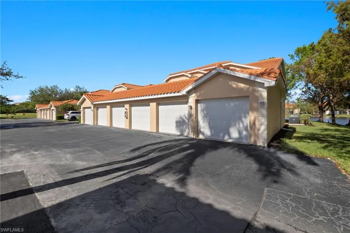 View of side of property. The garage is the second one from the right