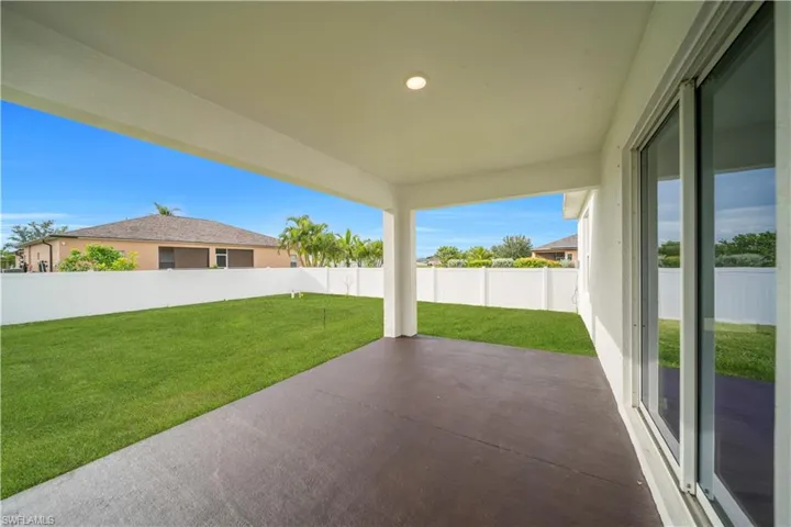 Fenced backyard featuring a patio area