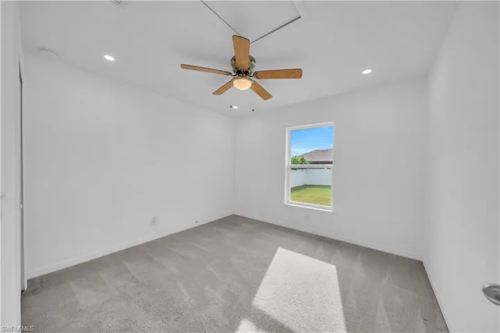Unfurnished room featuring light carpet, recessed lighting, and ceiling fan