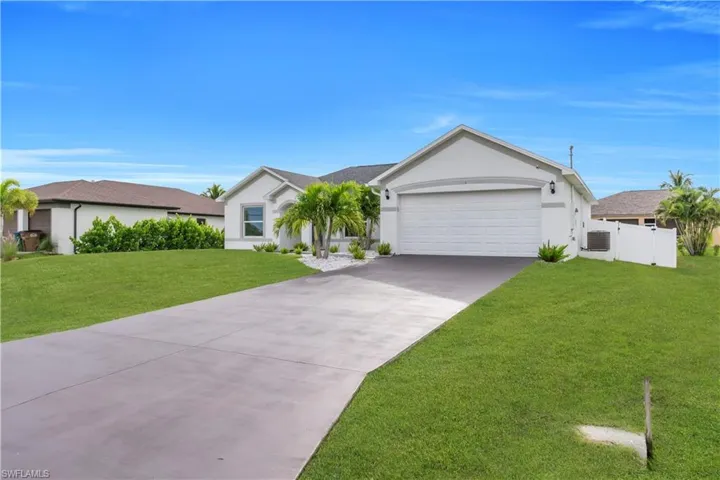 Single story home featuring stucco siding, concrete driveway, and an attached garage