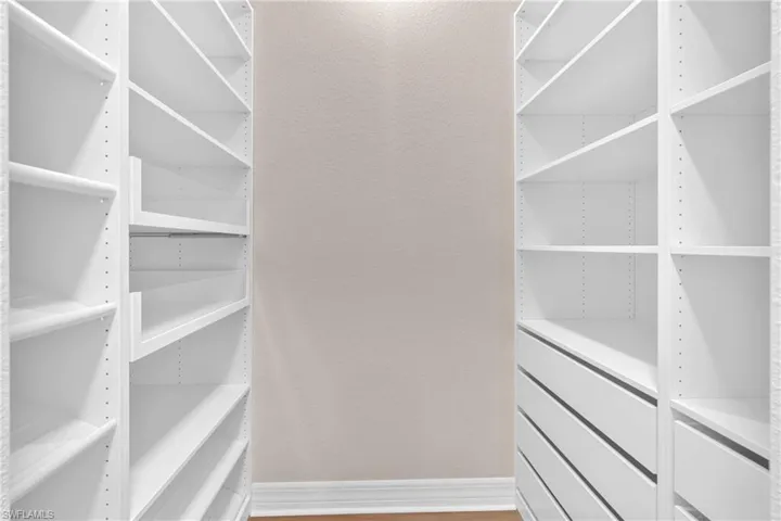 Walk in closet featuring light wood finished floors