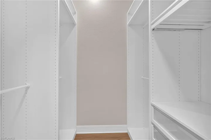 Walk in closet featuring light wood-type flooring