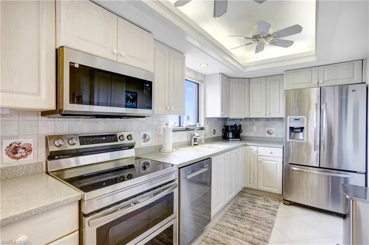 Newer stainless appliances, plenty of cabinetry and counter space.