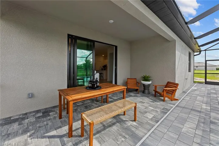 View of patio with a lanai