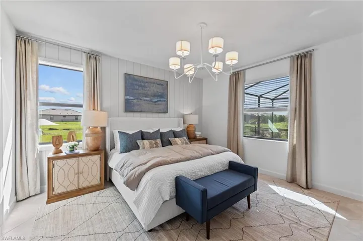 Bedroom featuring a chandelier and light tile patterned floors