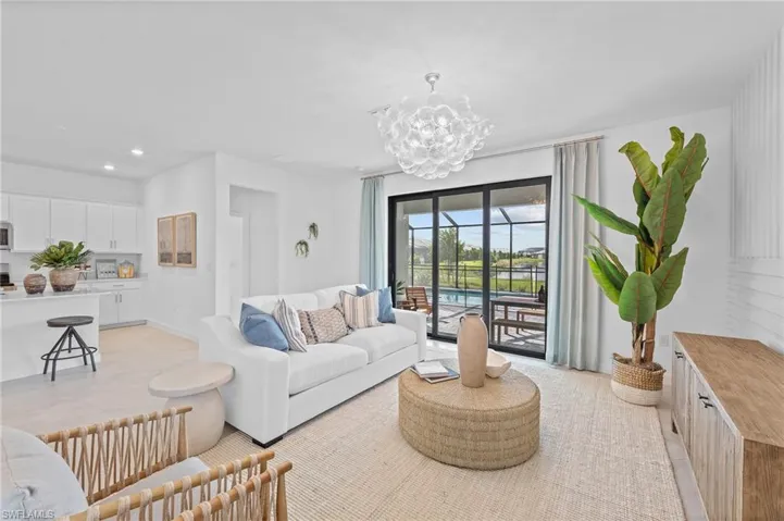 Living area featuring a chandelier and recessed lighting