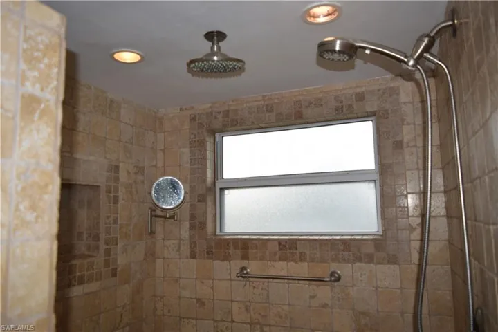 Full bathroom with tiled shower