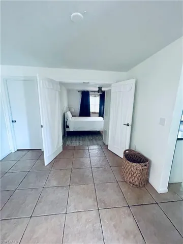 Unfurnished bedroom featuring light tile patterned floors