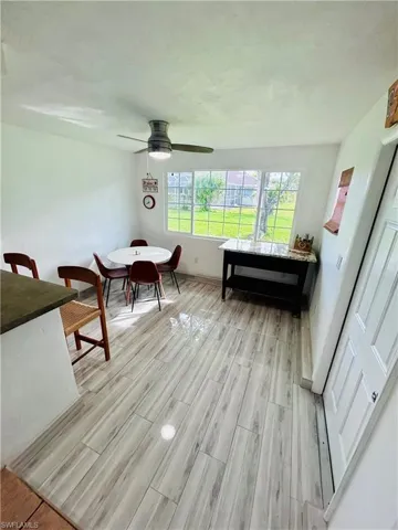 Dining area featuring wood finish floors and baseboards
