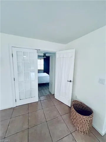Unfurnished bedroom featuring tile patterned floors