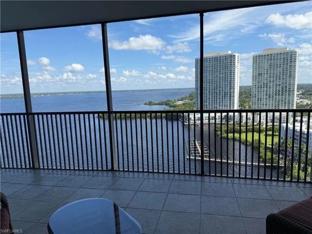 Sunroom with a water view and healthy amount of natural light