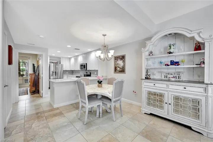 Dining and kitchen are open to one another.
