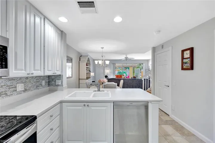 Enjoy pool views while preparing your favorite meal.