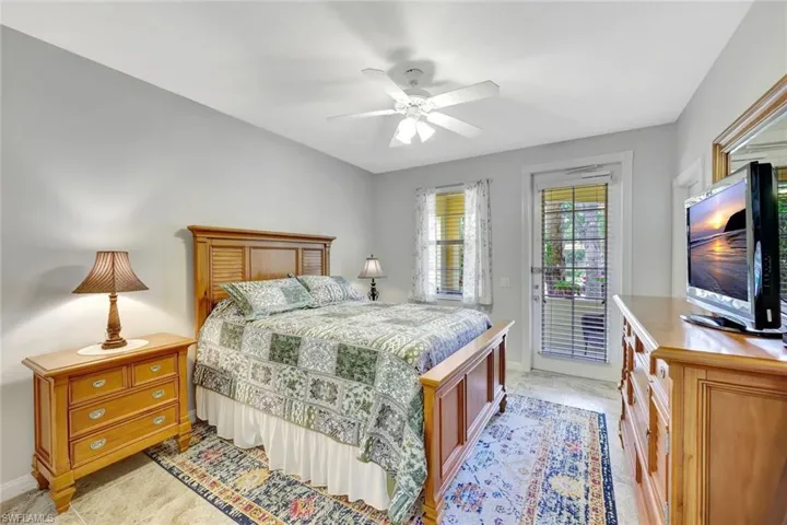 First floor guest bedroom features a private patio.