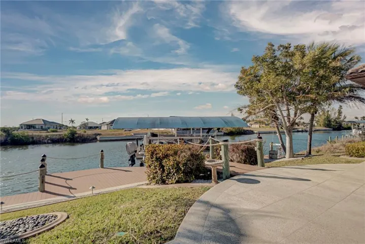Dock area featuring a water view