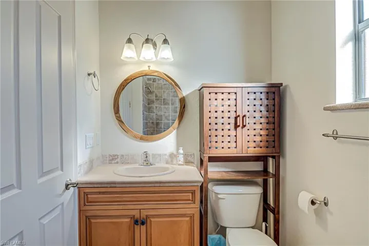 Full bathroom featuring vanity and a tile shower