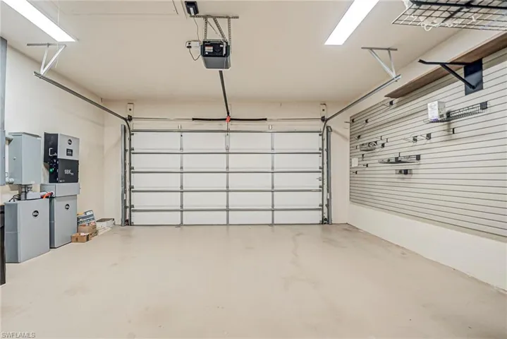 Garage featuring a garage door opener