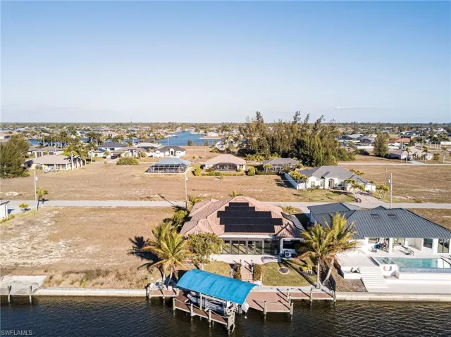 Aerial perspective of suburban area with a large body of water