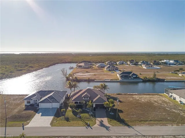 Aerial view of residential area with a large body of water