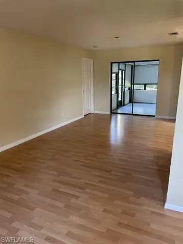 Unfurnished room with light wood-type flooring