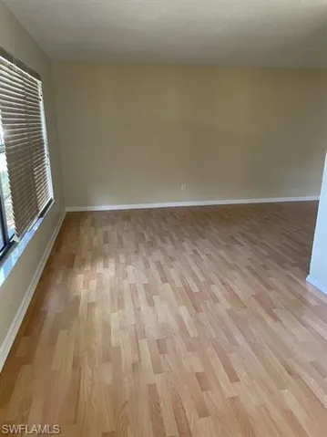 Spare room with light wood-style floors and a textured ceiling