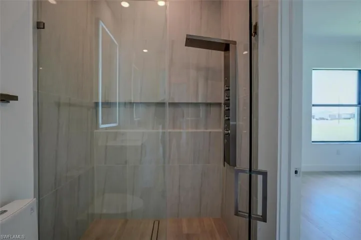 Bathroom featuring toilet and hardwood / wood-style floors