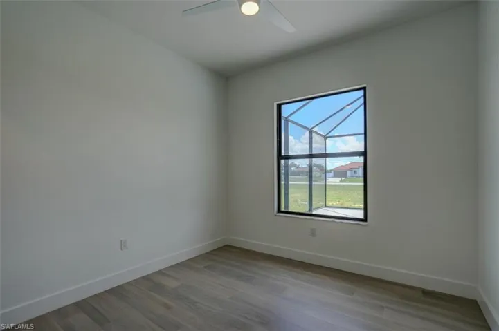 Spare room with ceiling fan and hardwood / wood-style floors
