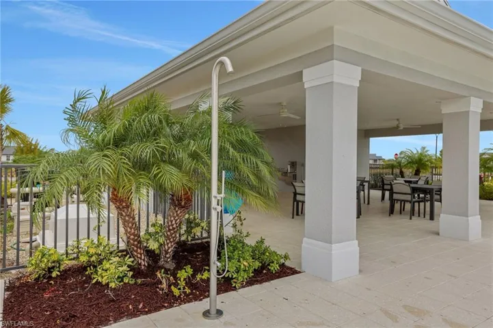 View of patio featuring outdoor dining area and ceiling fan