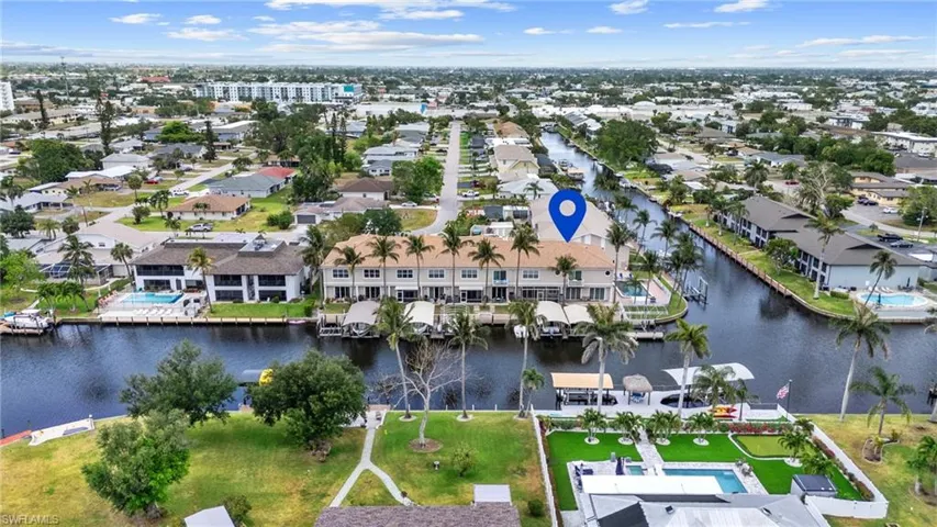 Aerial view featuring a water view and a residential view