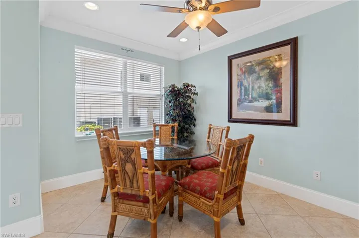 Dining area featuring ornamental molding, ceiling fan, recessed lighting, and light tile patterned floors