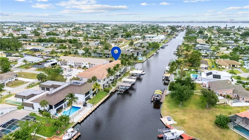 Aerial view featuring a water view and a residential view