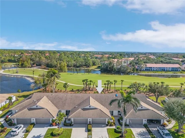 Aerial view with a water view and golf course view